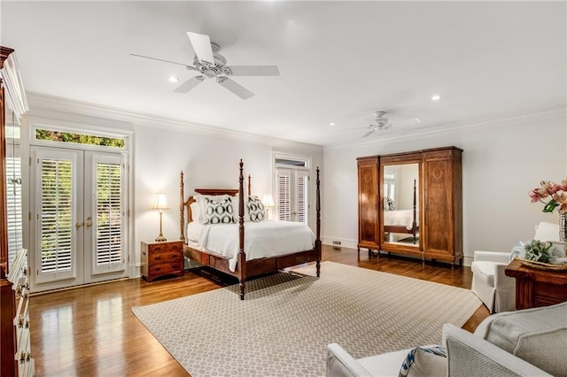 bedroom with french doors, ornamental molding, wood finished floors, access to outside, and baseboards