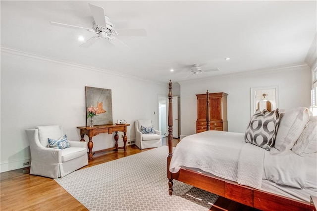 bedroom with baseboards, a ceiling fan, ornamental molding, wood finished floors, and recessed lighting