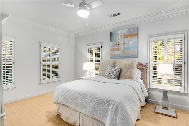 bedroom featuring light colored carpet, visible vents, a ceiling fan, baseboards, and crown molding