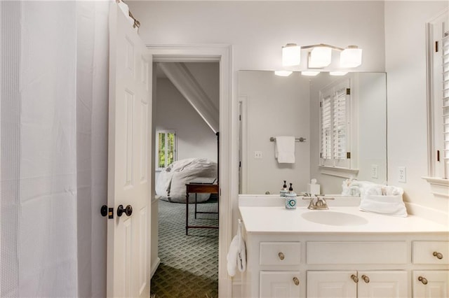 full bath featuring a shower with shower curtain, connected bathroom, and vanity