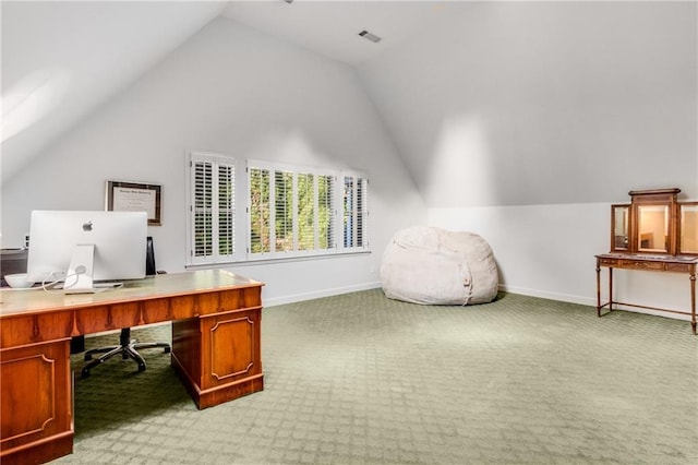 carpeted office space with visible vents, vaulted ceiling, and baseboards