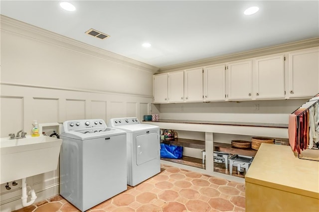 clothes washing area featuring recessed lighting, cabinet space, visible vents, ornamental molding, and independent washer and dryer