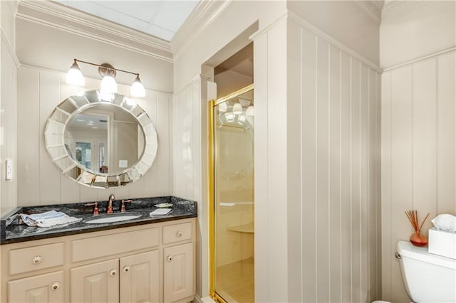 full bath with toilet, a shower stall, crown molding, and vanity