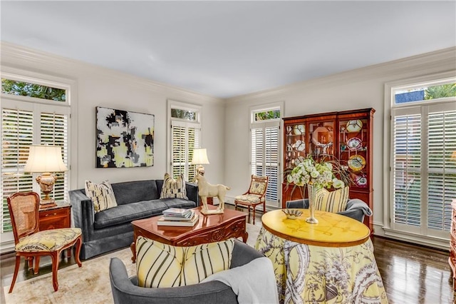 sitting room featuring crown molding and wood finished floors