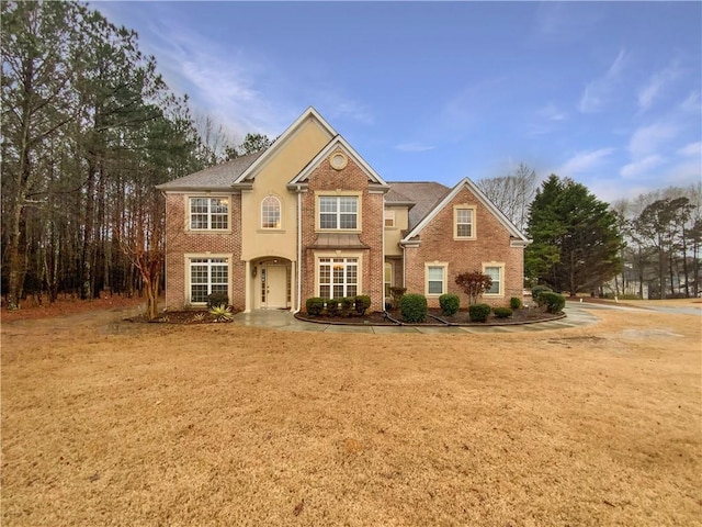 view of front of house with brick siding