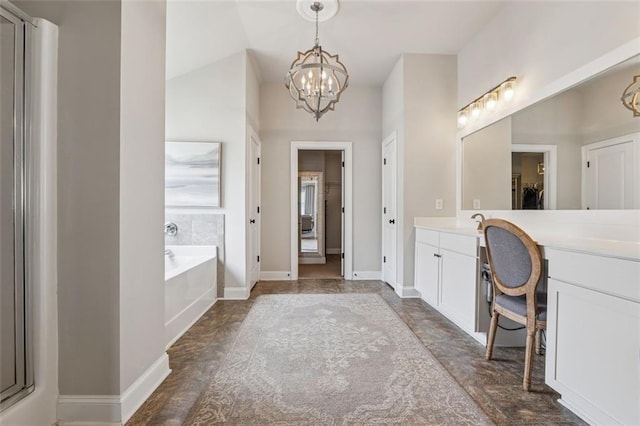 406 Dunaway Ct, Grayson, GA 30017 - full bathroom featuring vanity, a chandelier, and a garden tub