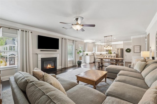 406 Dunaway Ct, Grayson, GA 30017 - living room with ornamental molding, a ceiling fan, a glass covered fireplace, dark wood-type flooring, and recessed lighting