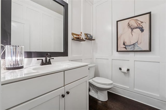 406 Dunaway Ct, Grayson, GA 30017 - half bath featuring vanity, a decorative wall, and wood finished floors