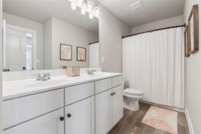406 Dunaway Ct, Grayson, GA 30017 - full bath featuring wood finished floors, double vanity, and curtained shower
