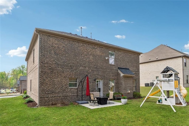 406 Dunaway Ct, Grayson, GA 30017 - back of house with brick siding, a patio, and a lawn