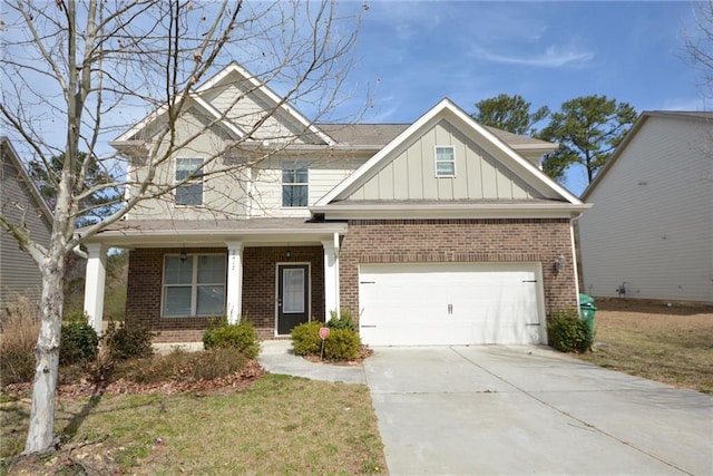 craftsman-style house with a front lawn, driveway, board and batten siding, a garage, and brick siding