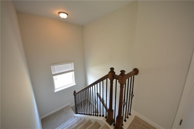 stairs with carpet flooring and baseboards