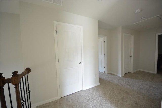 unfurnished bedroom featuring baseboards, visible vents, and carpet floors