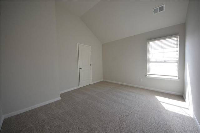 additional living space featuring visible vents, baseboards, high vaulted ceiling, and carpet flooring