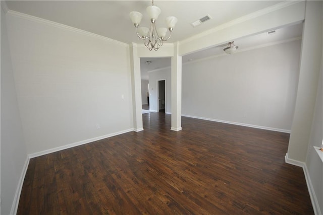 unfurnished dining area with visible vents, baseboards, dark wood finished floors, ornamental molding, and a notable chandelier