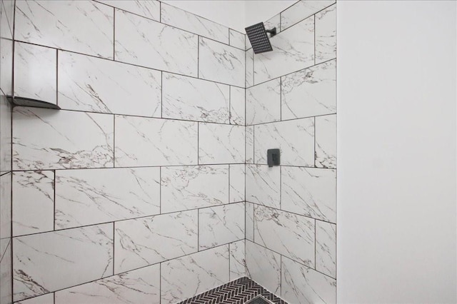 bathroom with tiled shower