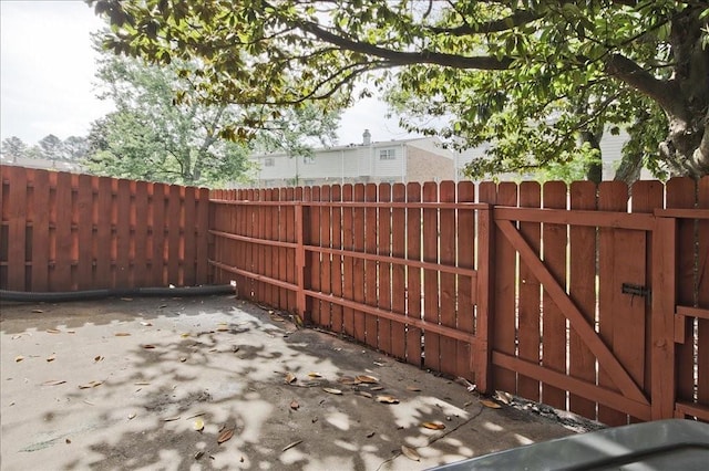 view of gate featuring fence