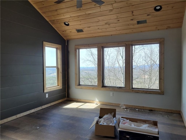 unfurnished sunroom with lofted ceiling, wood ceiling, and a ceiling fan