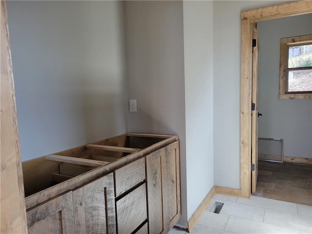 interior space with visible vents and baseboards