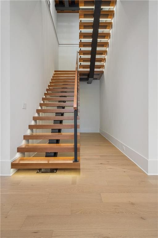 stairs with wood-type flooring