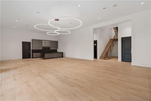 unfurnished living room with light wood-type flooring