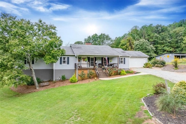 ranch-style home with a front yard, a porch, and a garage