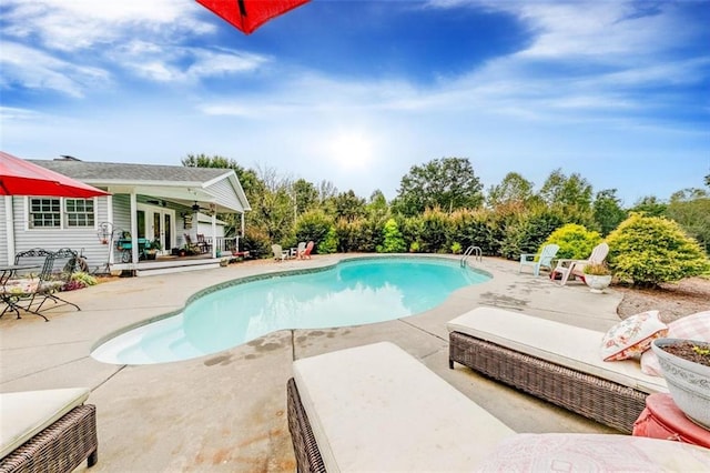 view of swimming pool featuring a patio area