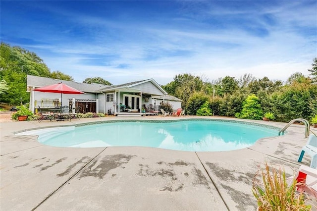 view of pool featuring a patio area