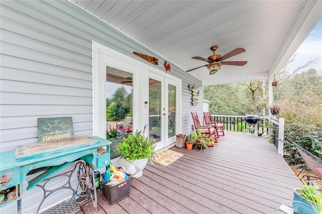 deck with ceiling fan and french doors