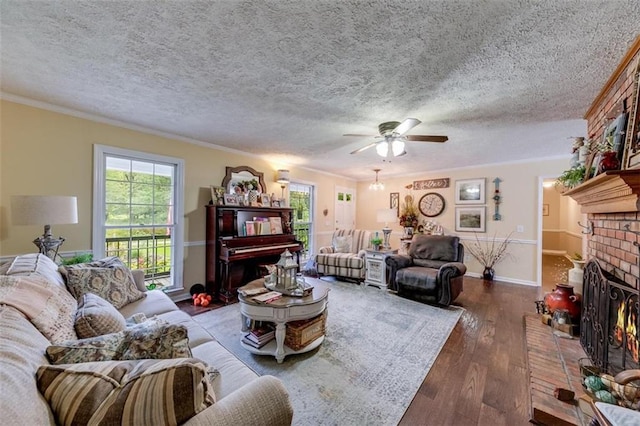 living room with ornamental molding, a textured ceiling, a fireplace, and hardwood / wood-style floors