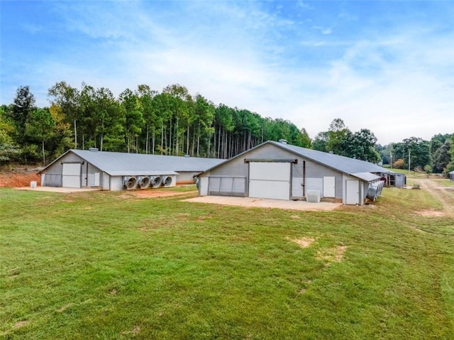 rear view of property with a lawn