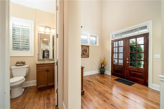 entryway featuring french doors and light wood-type flooring