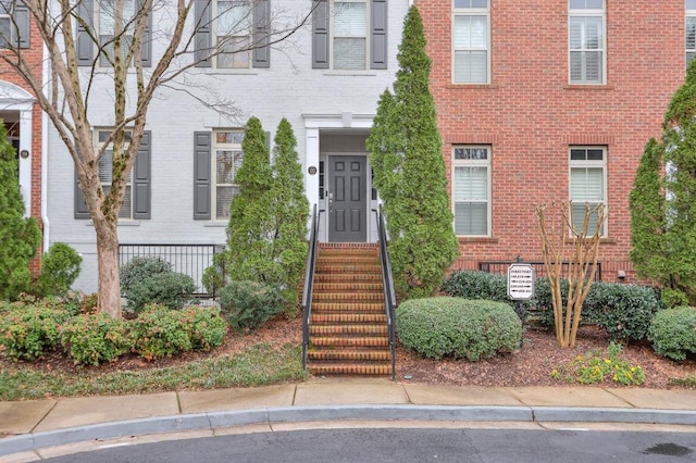 view of front of home with brick siding