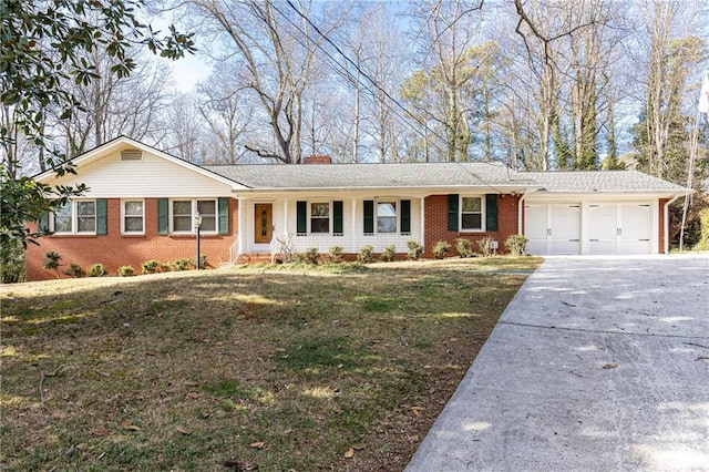 single story home with a garage, driveway, brick siding, and a front yard