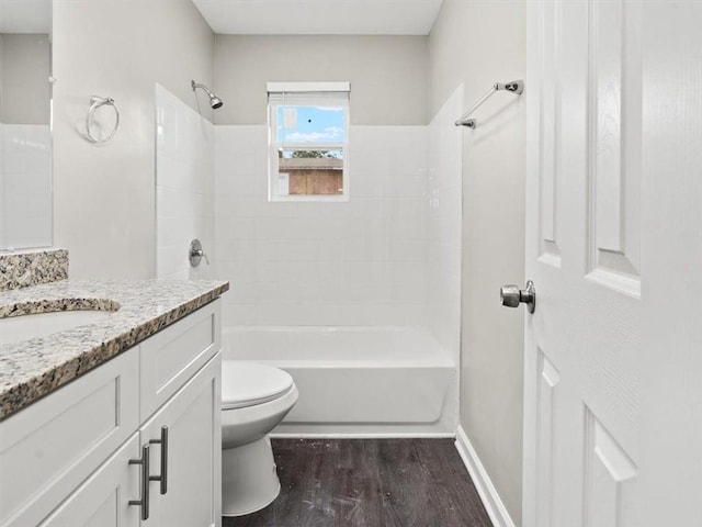 full bathroom featuring vanity, shower / bath combination, hardwood / wood-style floors, and toilet