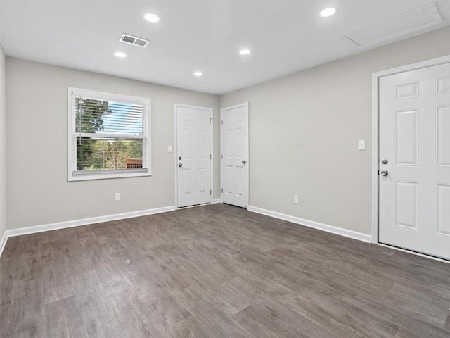 entrance foyer featuring dark hardwood / wood-style floors