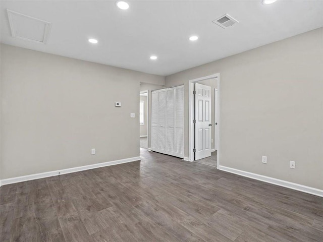 empty room featuring dark wood-type flooring