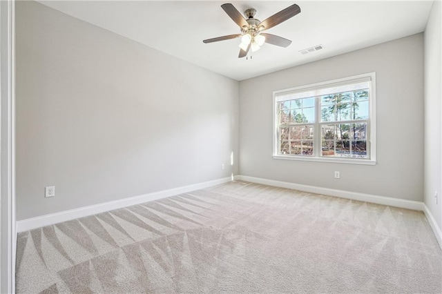 unfurnished room featuring visible vents, baseboards, ceiling fan, and carpet flooring