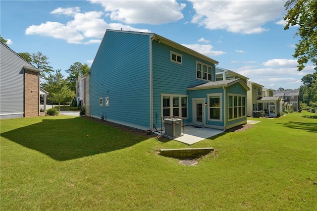 back of property featuring a patio area and a yard