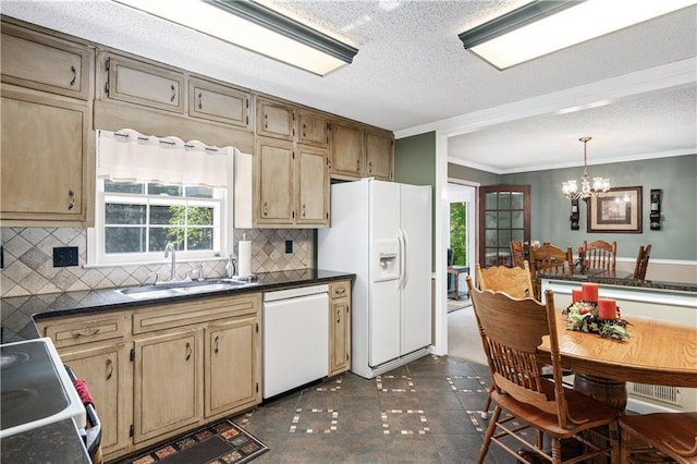 kitchen featuring a notable chandelier, decorative backsplash, white appliances, and plenty of natural light