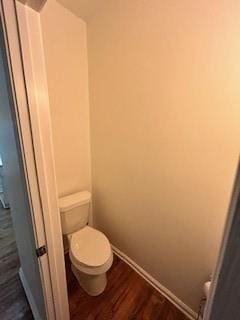 bathroom featuring toilet and hardwood / wood-style floors