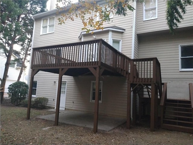 back of property featuring a deck