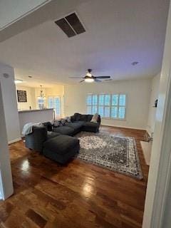 living room featuring hardwood / wood-style floors and ceiling fan