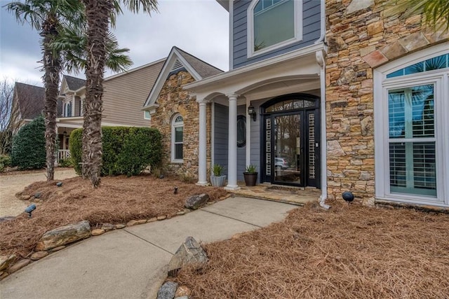 entrance to property with stone siding