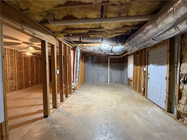 unfinished basement featuring ceiling fan