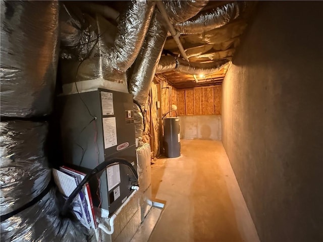 utility room featuring water heater