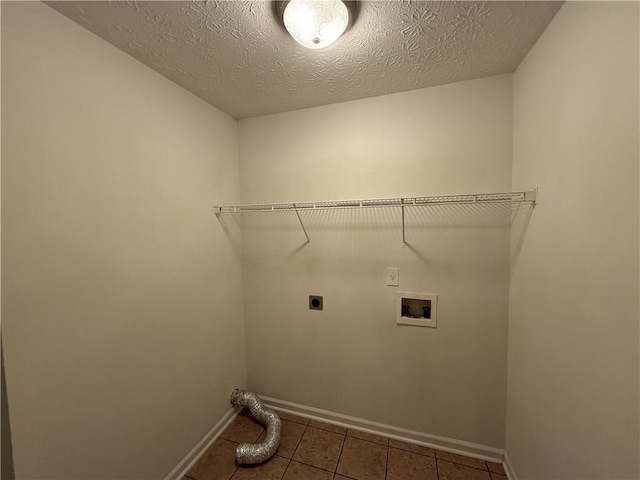 washroom featuring tile patterned flooring, hookup for a washing machine, hookup for an electric dryer, laundry area, and baseboards