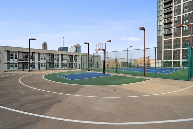 view of basketball court featuring tennis court