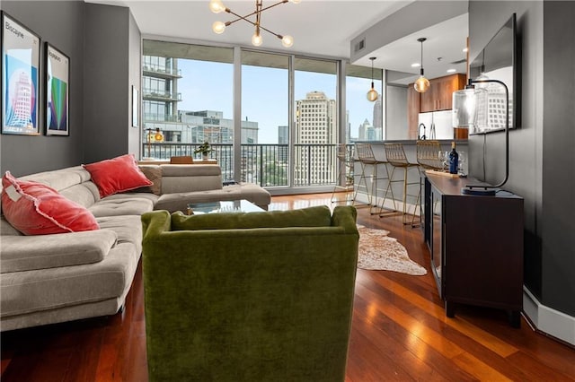 1080 Peachtree St NE Unit 2108, Atlanta, GA 30309 - living area with a chandelier, dark wood-style flooring, and floor to ceiling windows