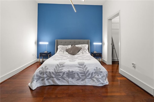 1080 Peachtree St NE Unit 2108, Atlanta, GA 30309 - bedroom with baseboards and wood finished floors